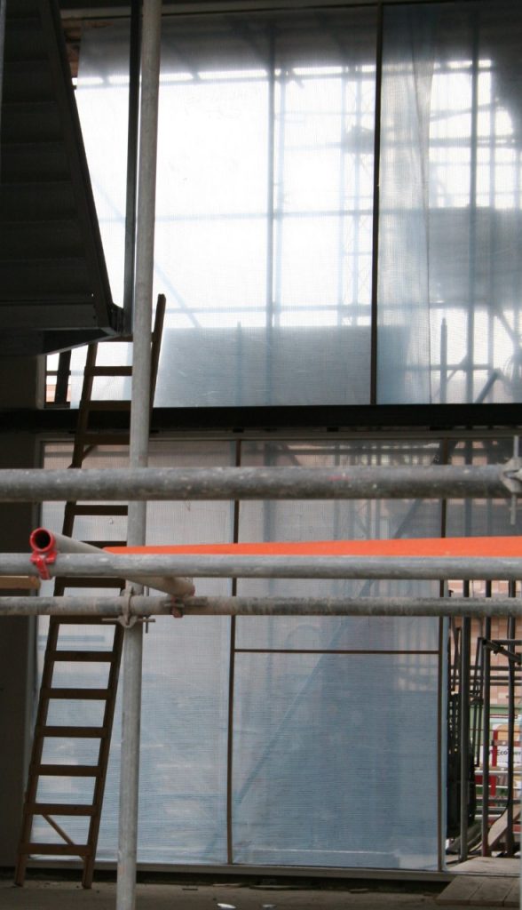 Industrial interior with window and ladder