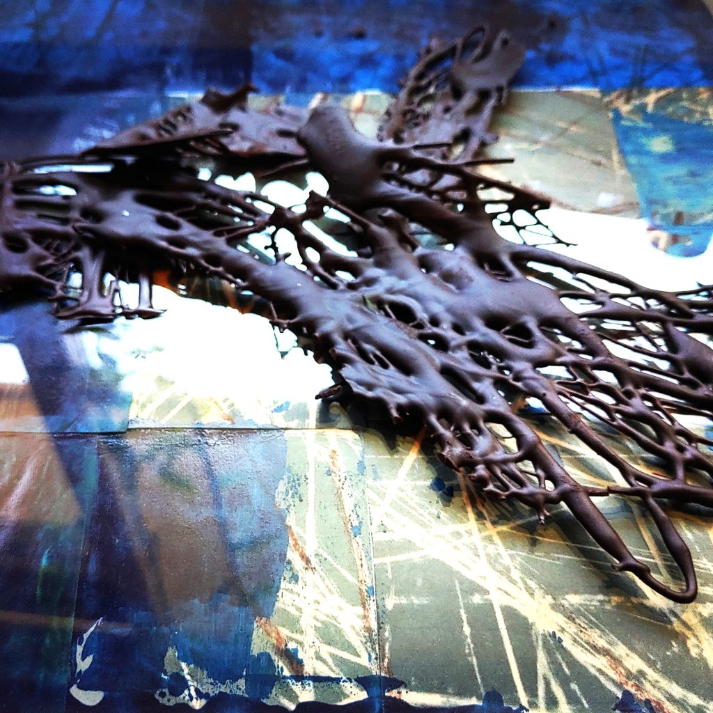 Abstract chocolate sculpture with blue tones